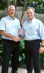 Steve Wilson of Hide-Away Storage Receives Award from Markus Hecker of SiteLink